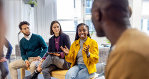 Woman sharing her view during team building session at startup office